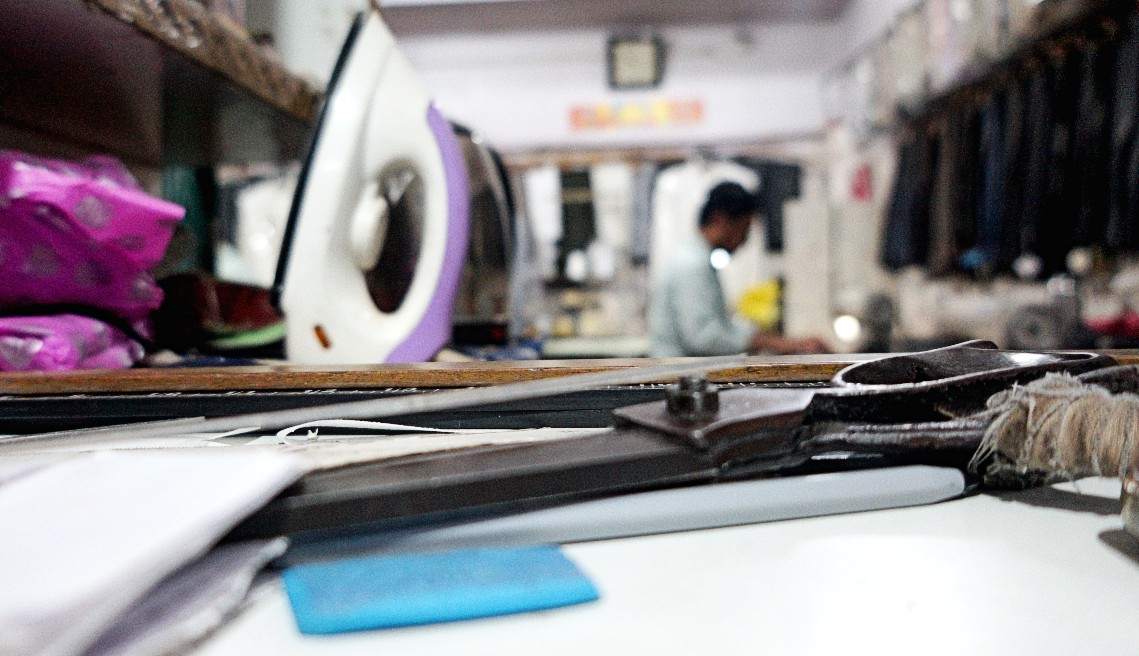 Tailor working on premium stitching